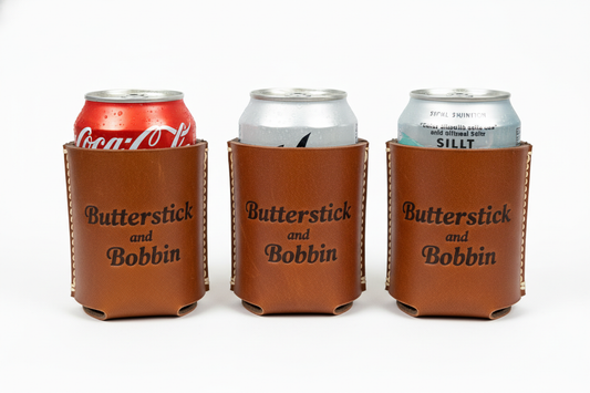 leather drink coozies that say Butterstick and Bobbin
